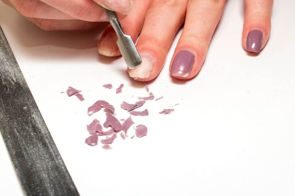 Soak your nails for a few minutes in acetone