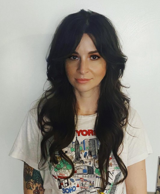 Curtain Bangs with a Deep Side Part